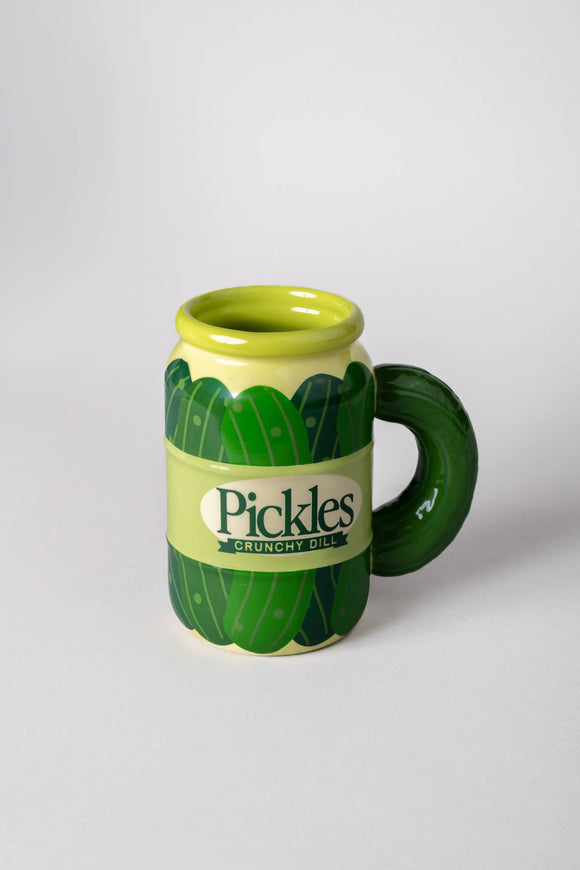 Green mug designed like pickles with 'Pickles Crunchy Oil' text on a white background