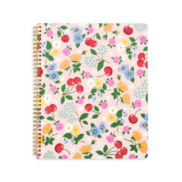 Notebook with floral and cherry pattern on a white background