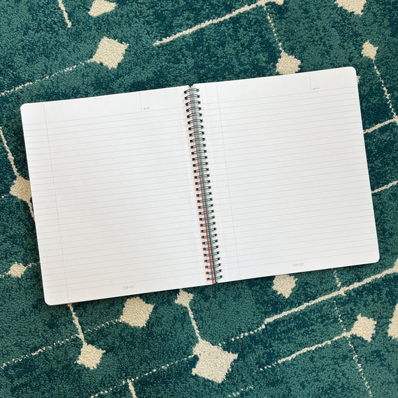 The inside of the Ban-do Be Nice Have Fun Rough Draft spiral-bound notebook. It has white lined paper.