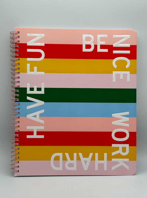 The Ban-do Be Nice Have Fun spiral-bound notebook. It says, "Be nice, work hard, have fun" around the edges in white writing with pink, red, yellow, green, and blue stripes across the whole notebook.