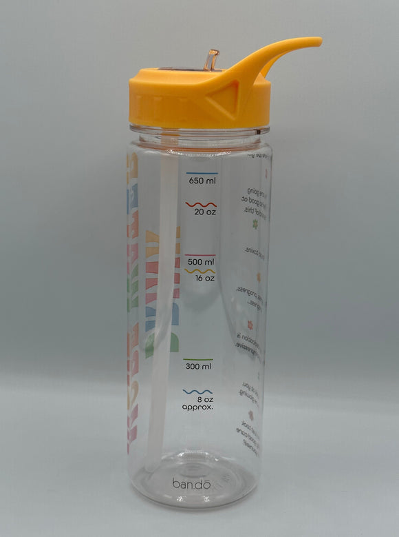 A clear water bottle with a yellow lid. Showcases the markings along the side of the bottle for 8 oz, 300 mL, 16 ox, 500 mL, 20 oz, and 650 mL. The oz markings are shown by squiggly lines and the mL markings are shown by straight lines.