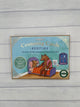 a light blue box with a gold border. It says, "eeboo Centering Cards Bedtime Exercises & Visualizations to Settle into Bed". It features a big bear tucking a little bear into bed.