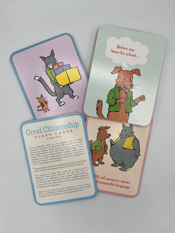 Examples of the Eeboo Good Citizenship cards. One contains instructions, two contain the side that have the good deed on them and one contains the other side of the card that shows an animal saying when to do the good deed.