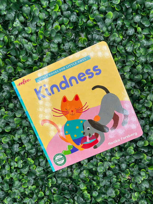 The cover of the Eeboo Kindness book. The cover is yellow with a cat giving a dog water, and it says, "Kindness" in purple letter.s