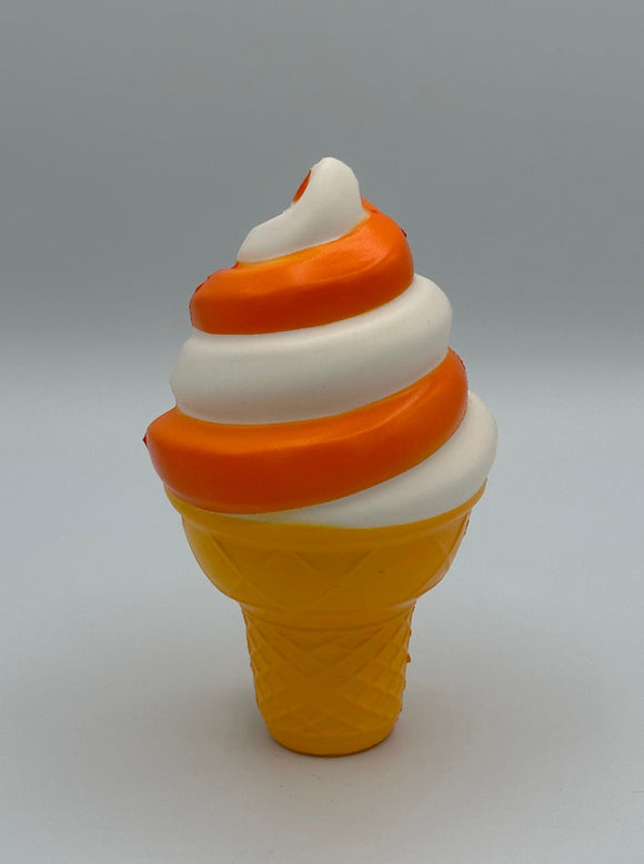 The Ban-do Ice Cream Stress Ball. It is an orange and white swirl ice cream cone.