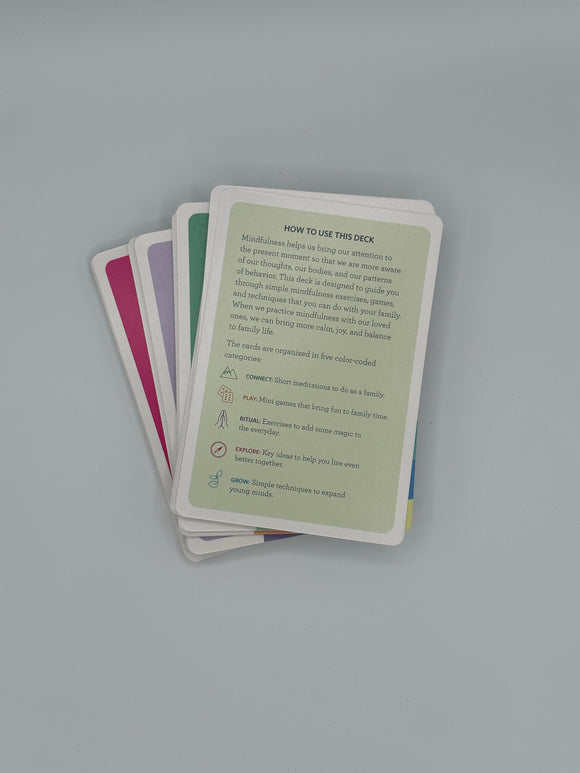 Stack of the Mindfulness Cards. The top card is a sage green card that shows the instructions on how to use the deck