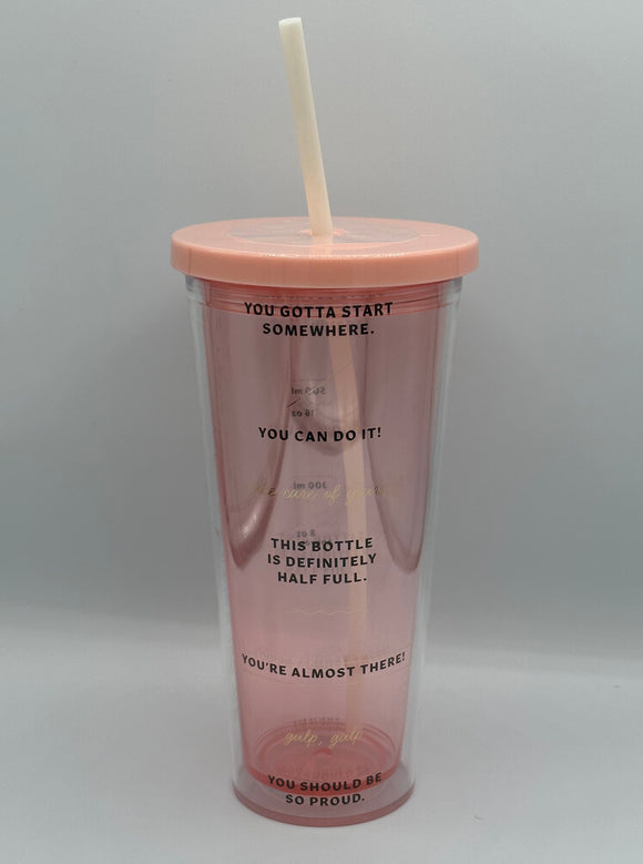 The Ban-do Sip Sip Tumbler. It is clear pink with a pink lid and white straw. It has motivational quotes at each benchmark, for example, "You gotta start somewhere" and, "This bottle is definitely half full."