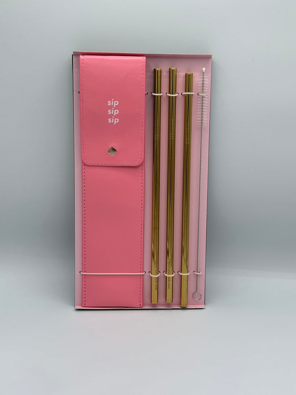 A set of 3 gold straws, a straw cleaner, and a pink leather pouch to hold the straws that says, "sip, sip, sip" in white all in a light pink box.