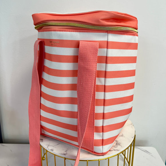 Peach and white striped fabric cooler with a gold zipper, peach top, and peach straps. It says, "kate spade, New York" in small gold font at the top.