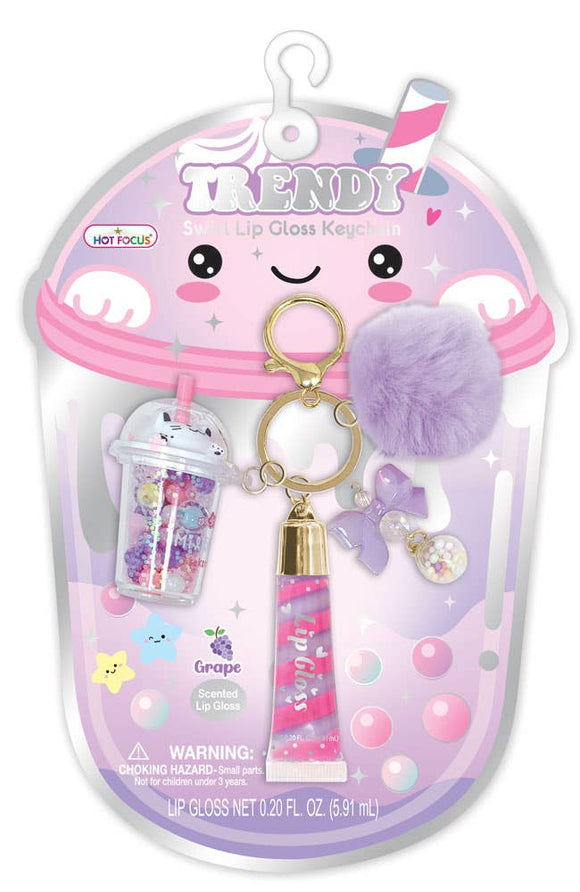 Lip gloss keychain set with packaging featuring a smiling boba on a white background