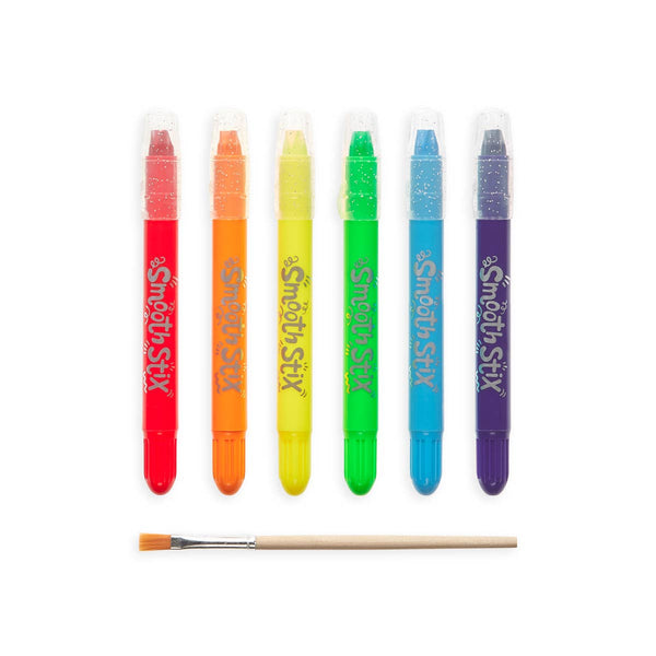 Set of colorful Smooth Stix crayons with a brush on a white background