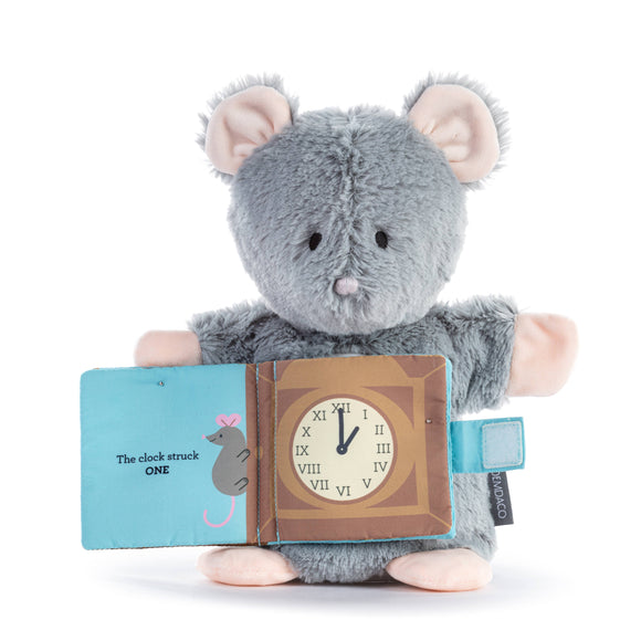 Plush toy mouse holding a book with a clock illustration on a white background
