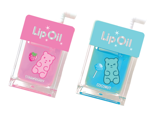 Two lip oil containers, one pink with a strawberry design and one blue with a coconut design, on a white background.