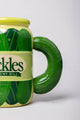 Green pickle-shaped mug with 'Pickles' text on a white background