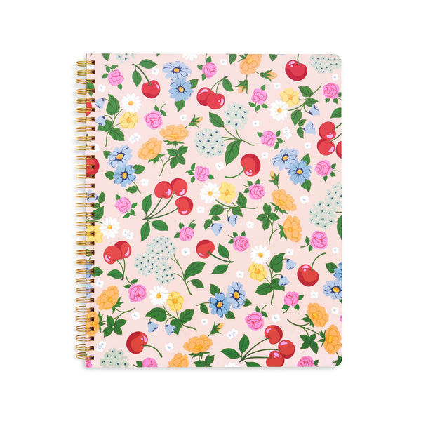 Notebook with floral and cherry pattern on a white background