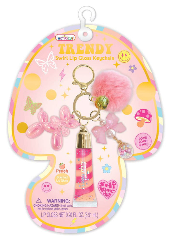 Pink lip gloss keychain with balloon dog and bow charms on a colorful Trendy packaging.