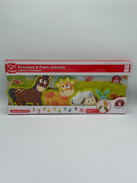 Hape Numbers & Farm Animals box. It is white with a red strip that says, "Numbers & Farm Animals". In the middle there is the puzzle. It has a light green border with a horse, cow, sheep, rabbit, and rooster in a line. Along the bottom there is a rainbow set of numbers going up to 10.