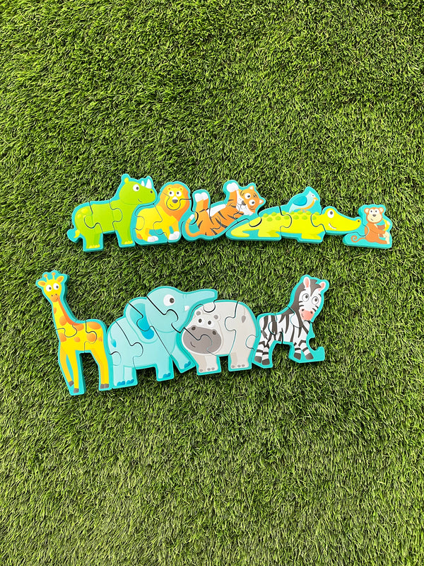 Front of the Hape alphabet and animal parade. The line of animals is split into two rows. From left to right, there is a green rhino, a yellow lion, an orange tiger lying on its back, a green alligator with a blue bird sitting on it, a brown monkey holding a banana, a yellow giraffe, a blue elephant, a grey rhino, and a black and white zebra.