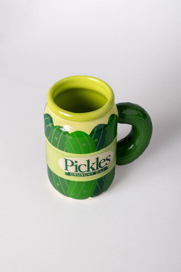 Green mug with leaf design and 'Pickles Crunch' text on a white background