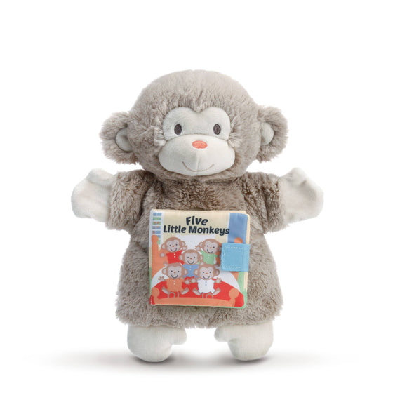 Plush monkey toy holding a book titled 'Five Little Monkeys' on a white background