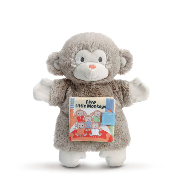 Plush monkey toy holding a book titled 'Five Little Monkeys' on a white background